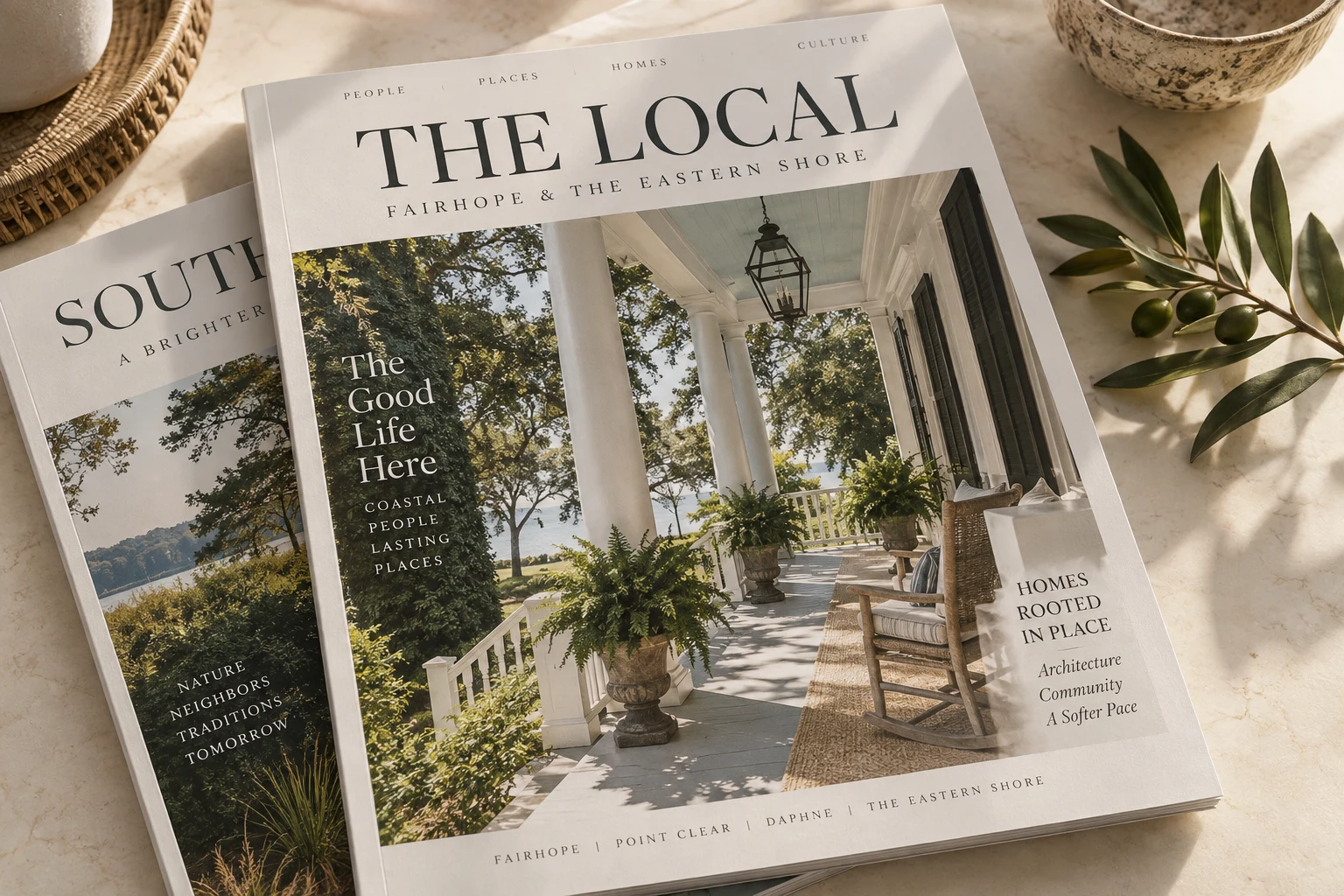 A beautifully designed local lifestyle magazine resting on a sunlit table